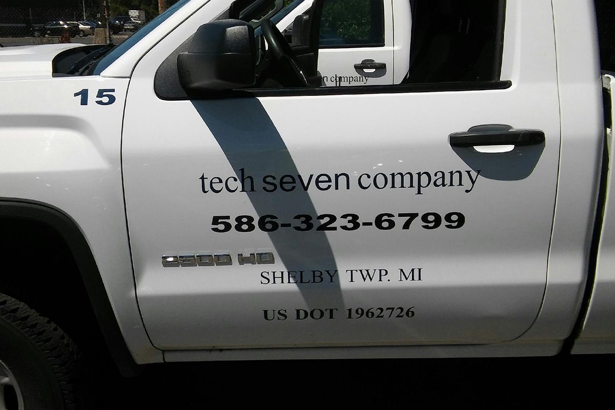 A white truck with the number 15 on it