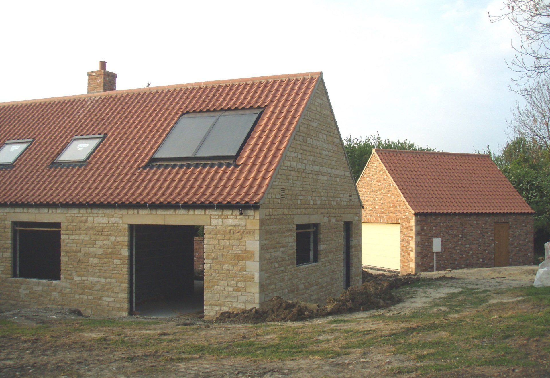 Stone chalet bungalow and Detached Brick Garage With Pantile Roofs