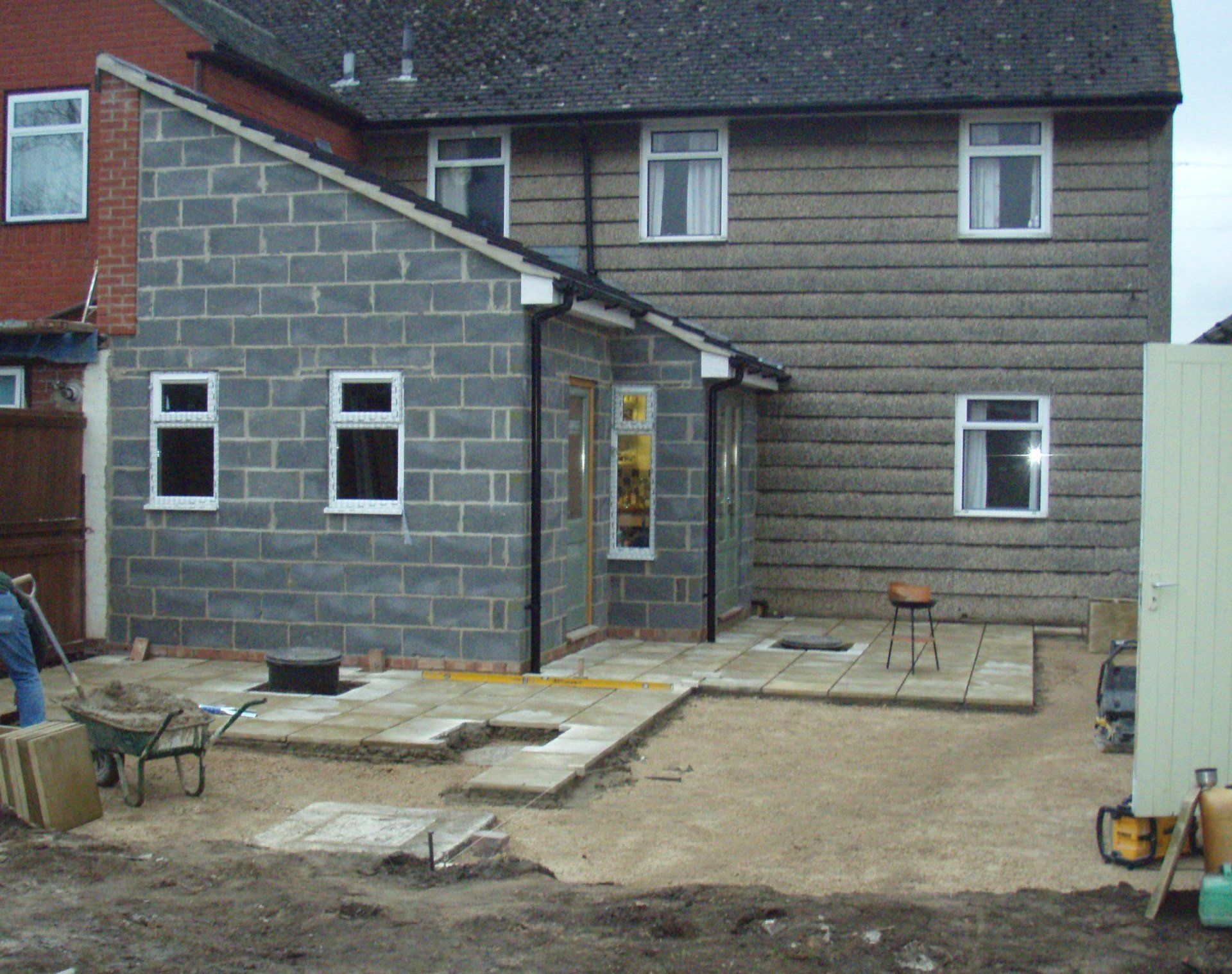 Pre-rendered extension complete and patio is being laid
