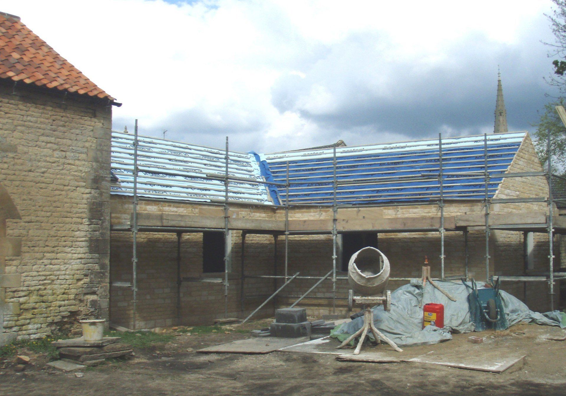 Stonework structure completed and roof covered in