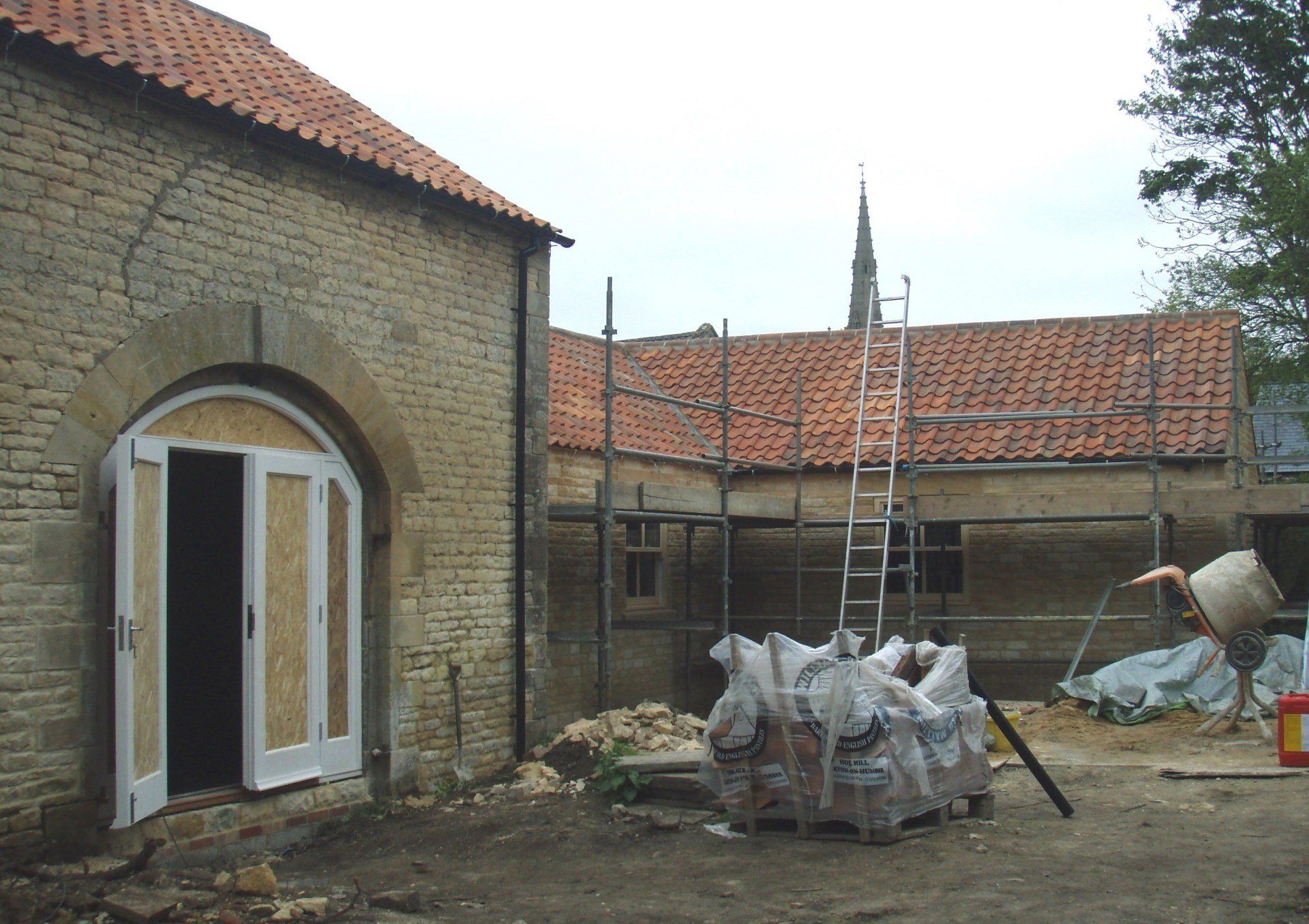 Roof completed and windows and doors being fitted