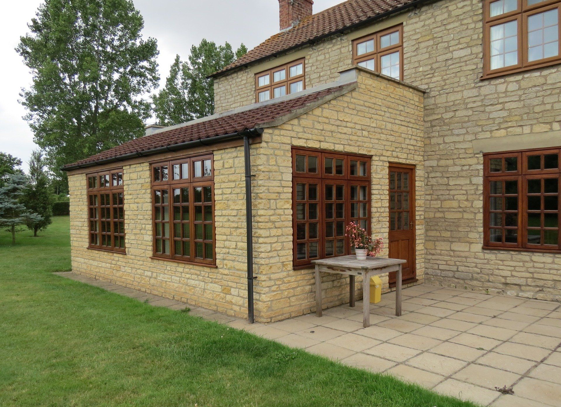 Stone Garden Room With Pantile Roof And Timber Windows
