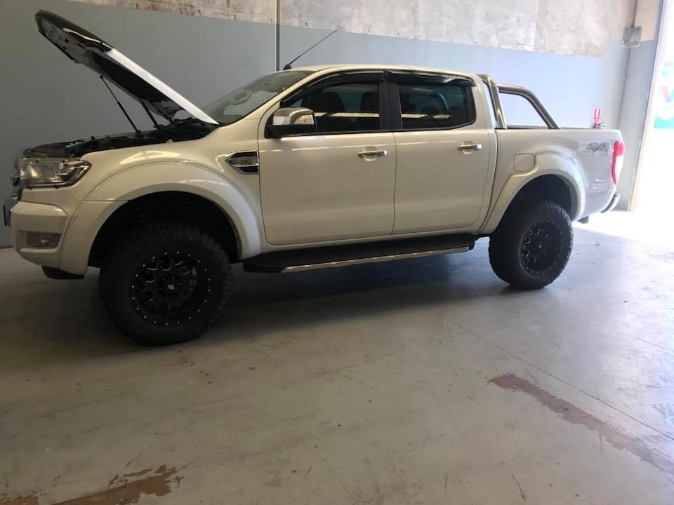 A Car With the Hood Up is Parked in a Garage — Maroochy Automotive in Kunda Park, QLD