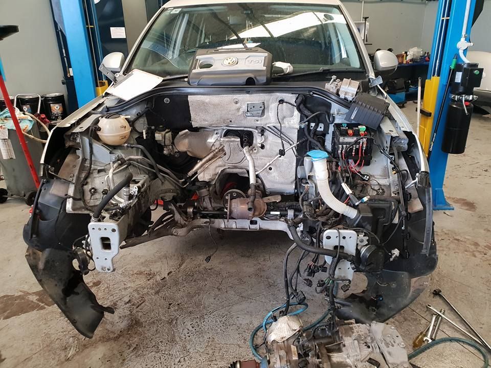 A White Car In A Mechanical Garage