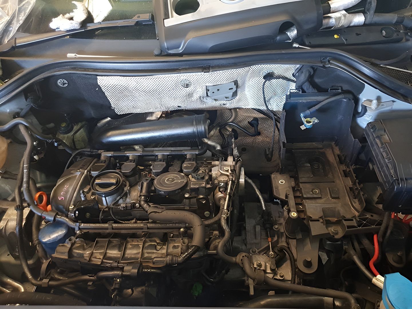 Mechanic In Maroochydore Examining Exposed Engine Components During Oil Change Service