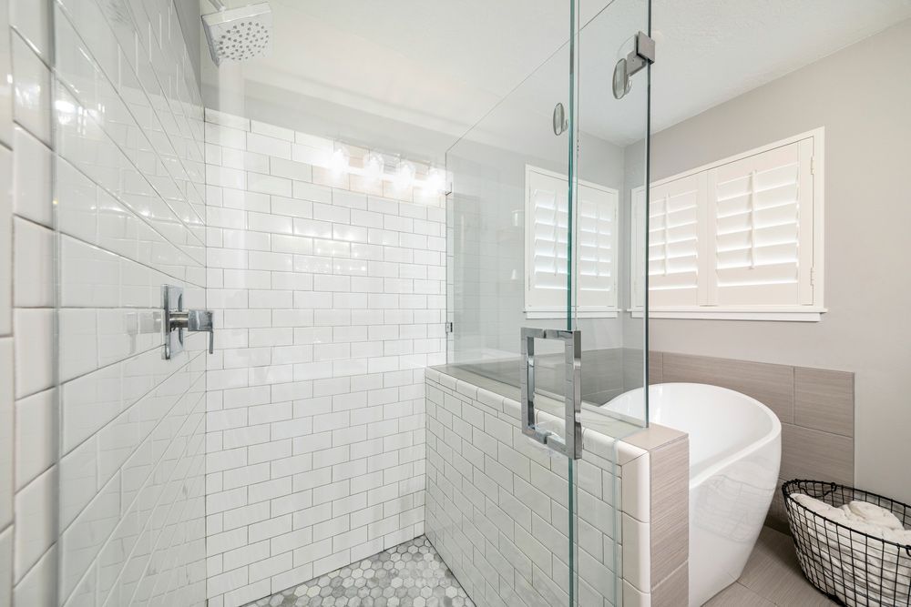 A Bathroom With A Walk In Shower And A Bathtub — InStyle Shower Screens & Wardrobes in Wyong, NSW