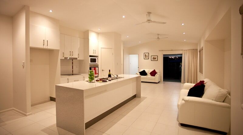 A Living Room with A Couch and A Kitchen — Leader Constructions in Cranbrook, QLD
