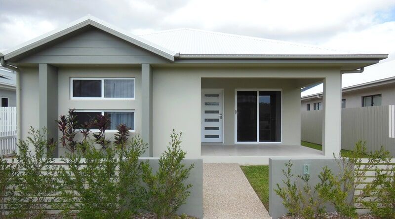 A Small White House with A Walkway Leading to It — Leader Constructions in Cranbrook, QLD