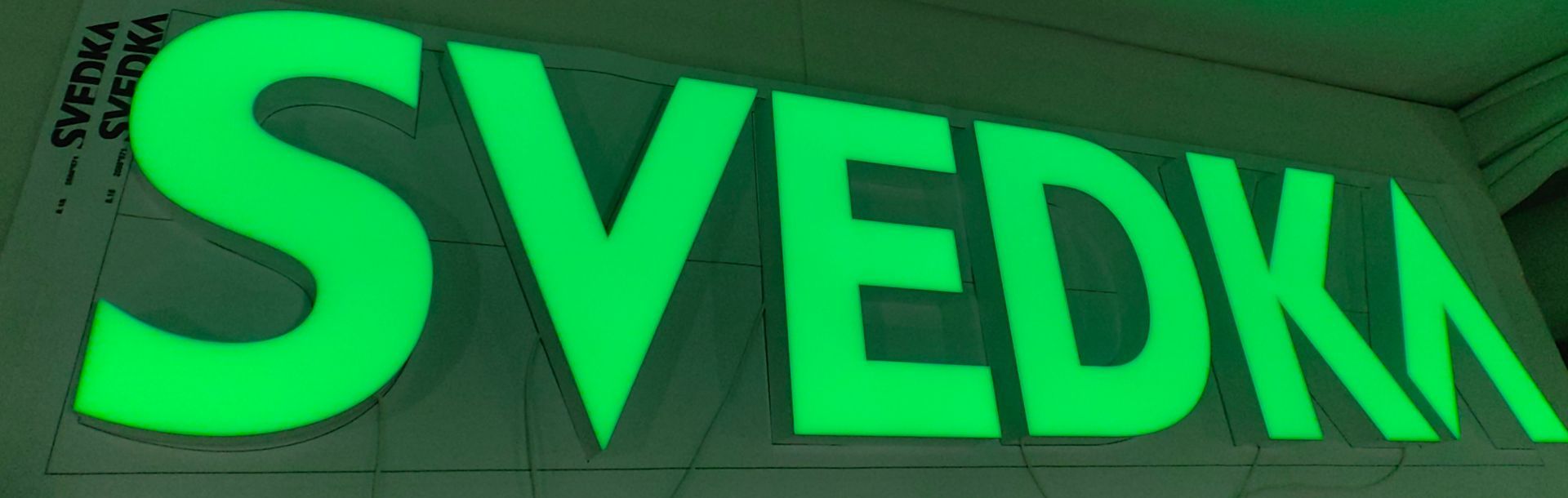 The word svedka is glowing in the dark