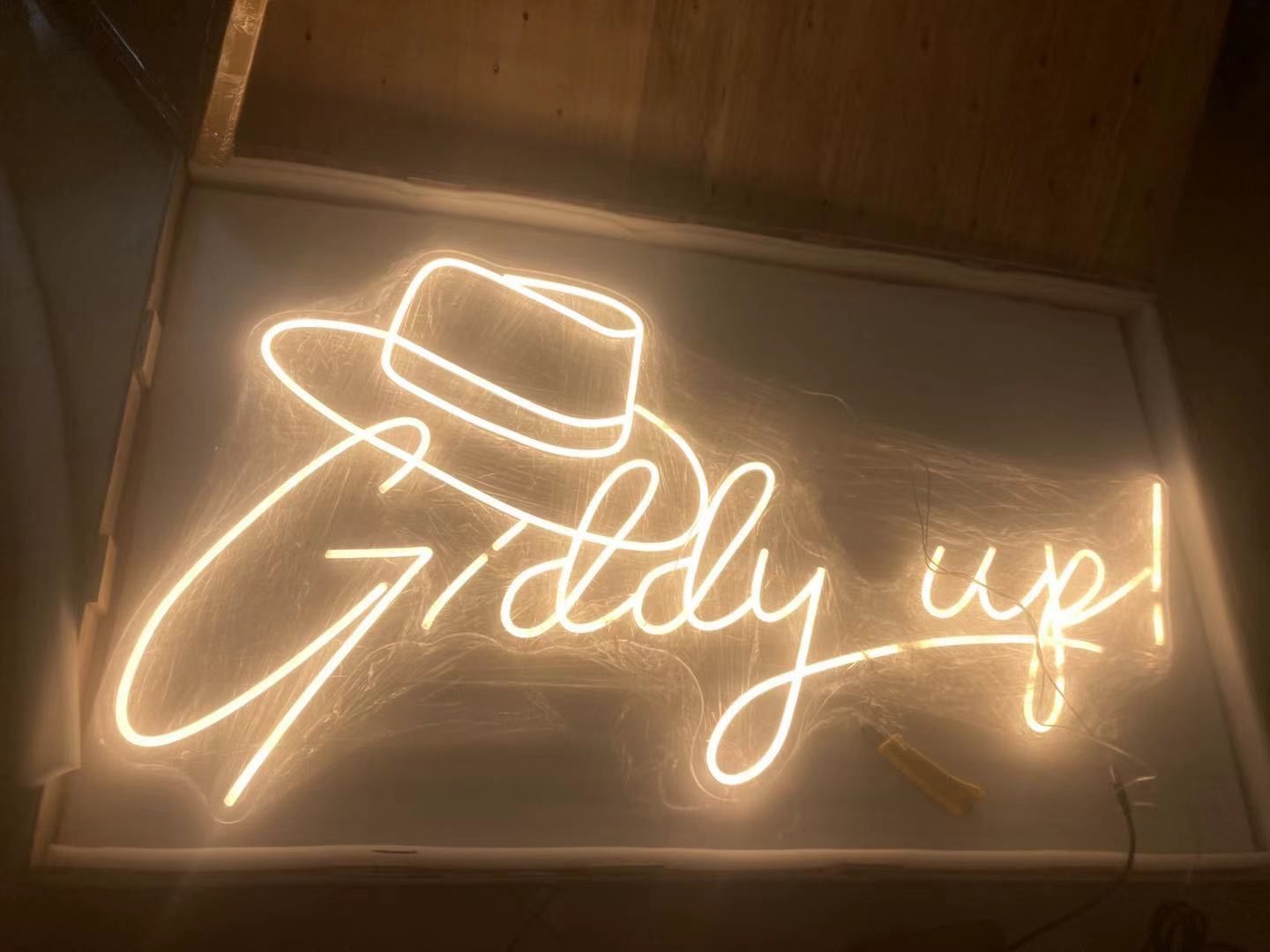 A Neon Sign that says Giddy Up