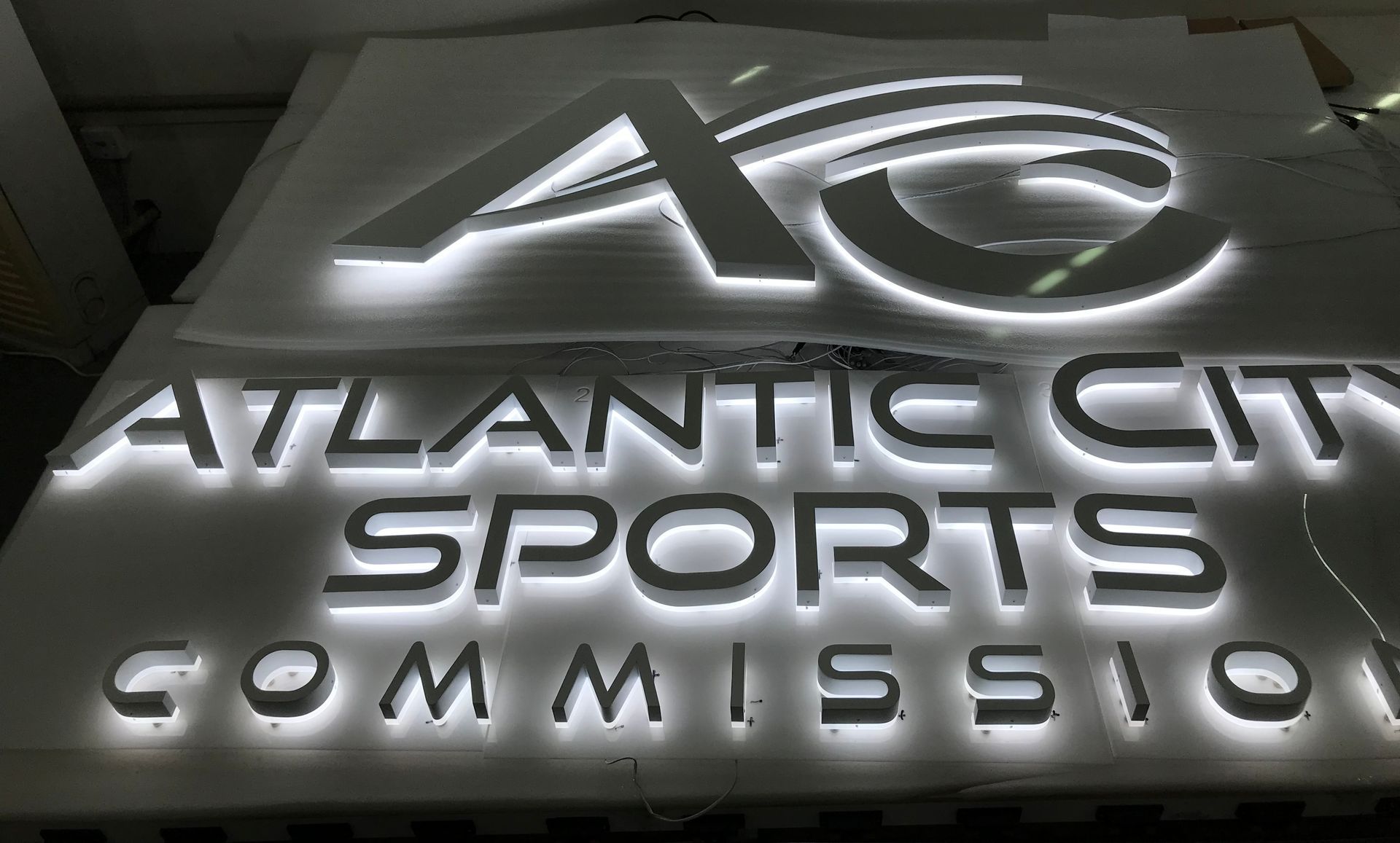 A sign for the atlantic city sports commission is lit up