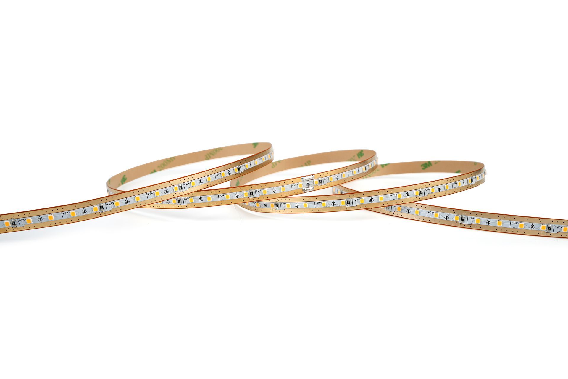 Flexible LED light strip, rolled and coiled on a white surface, with a sticky backing.