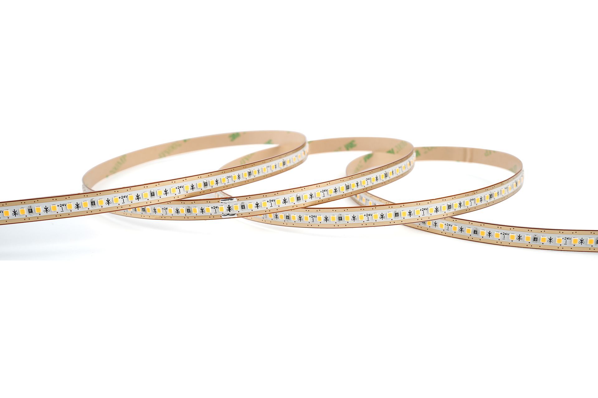 Flexible LED light strip on a white background, coiled with adhesive backing.