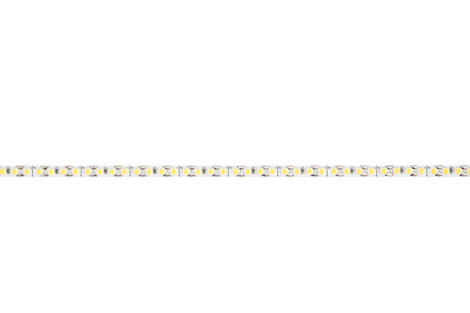Flexible LED light strip, tan with evenly spaced white lights, coiled on white background.