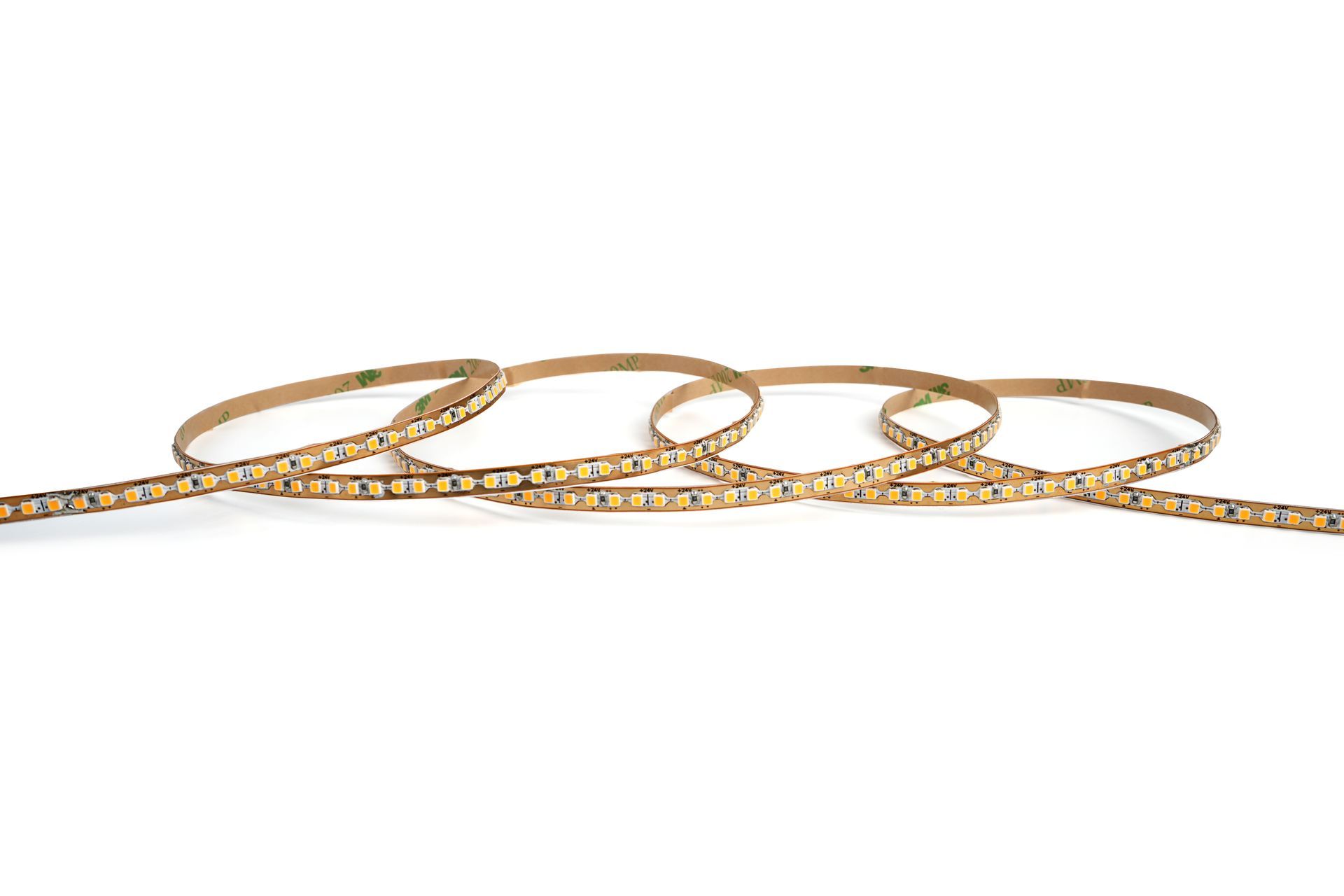 LED light strip, coiled on a white surface, with multiple small lights along its length.