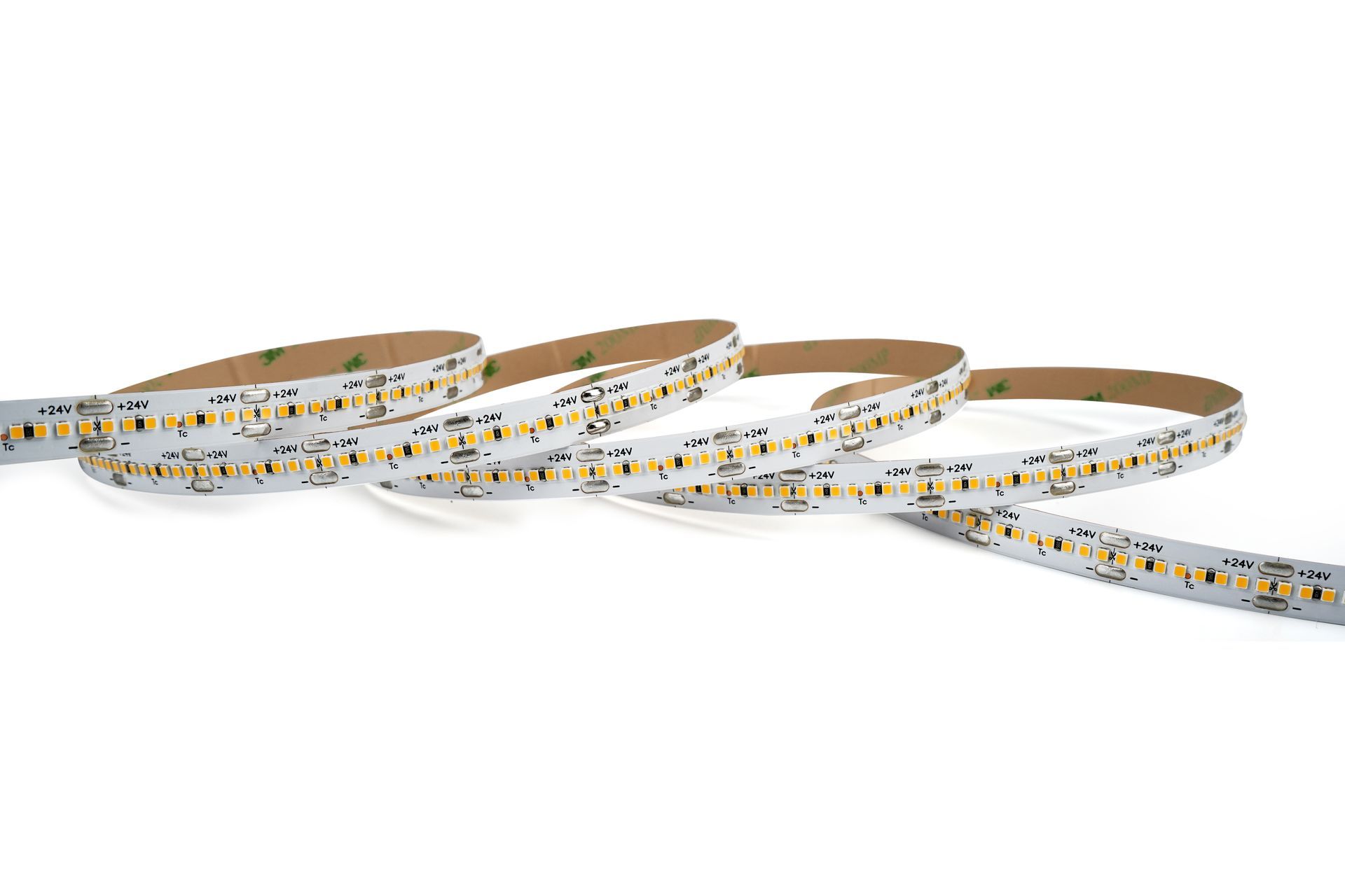 Flexible LED light strip, white and yellow, with adhesive backing, rolled up.