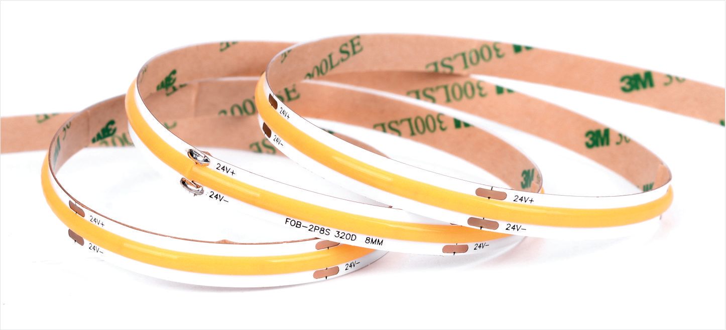 Yellow LED light strips with adhesive backing, coiled on a white surface.