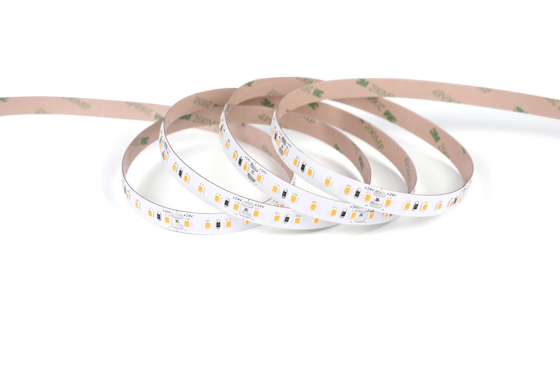 Flexible LED strip light, coiled, with adhesive backing.