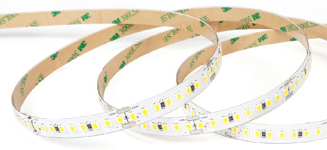 LED light strip coiled, revealing lights and adhesive backing.