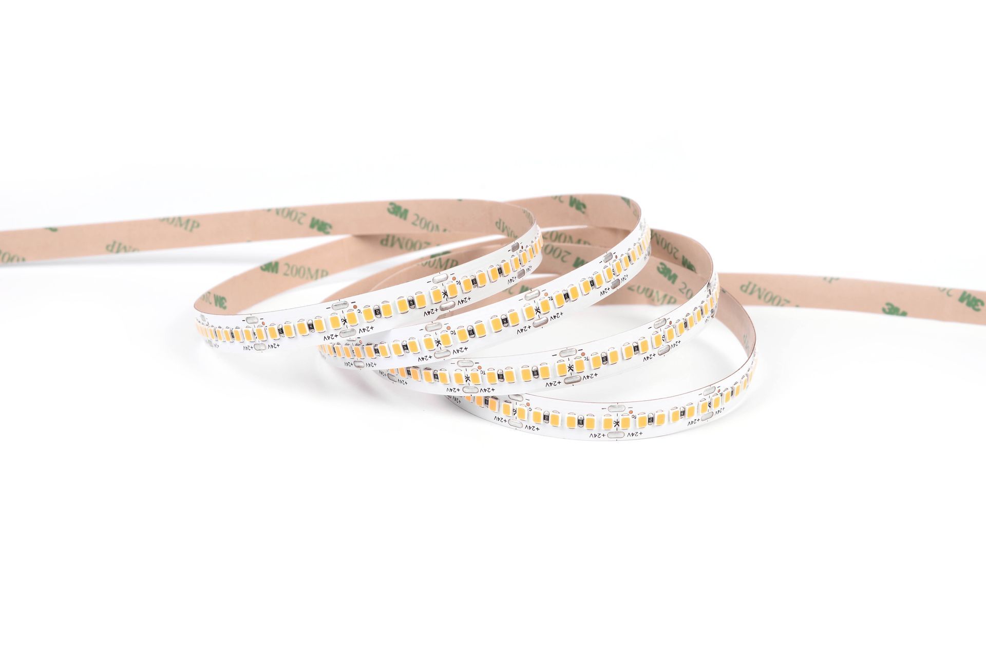 LED light strip coiled, with adhesive backing.