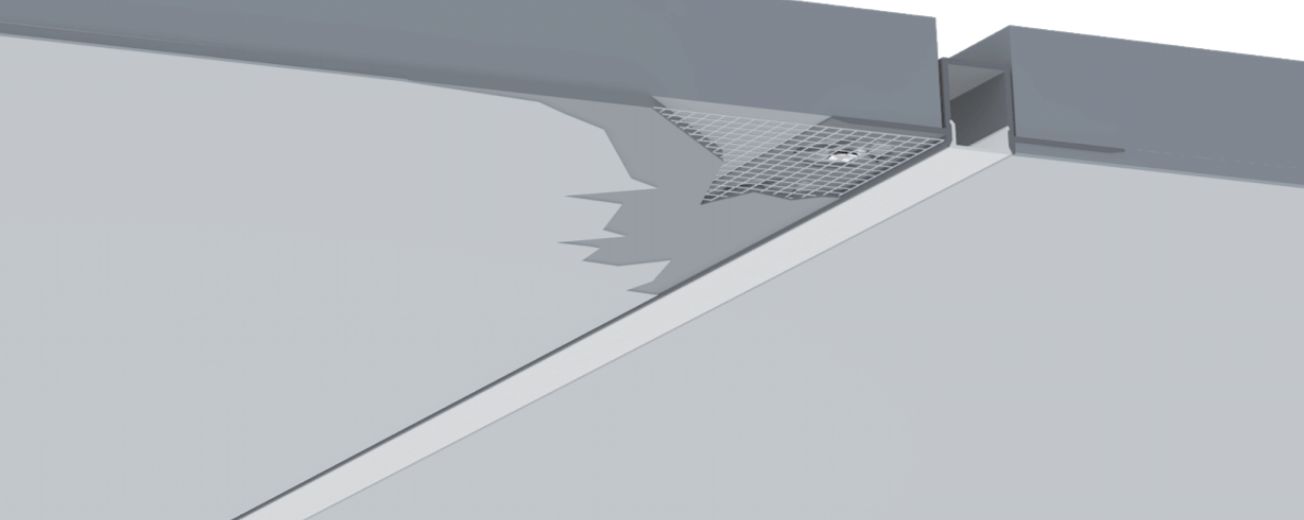 Close-up of a gray architectural design with angular shapes and shadows.