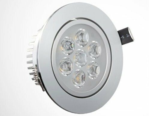 Chrome-colored recessed LED light fixture with seven bulbs; white background.