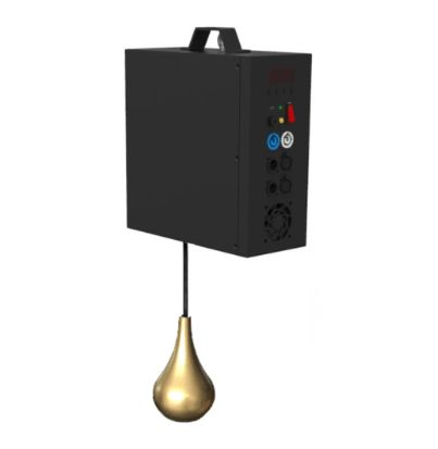 Black box device with gold teardrop-shaped object hanging below. Handle on top, control panel on side.