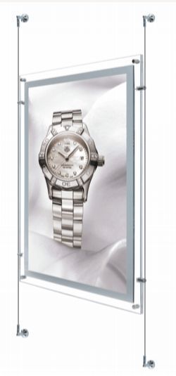 A wristwatch display, featuring a silver watch. The display is mounted on a hanging system.