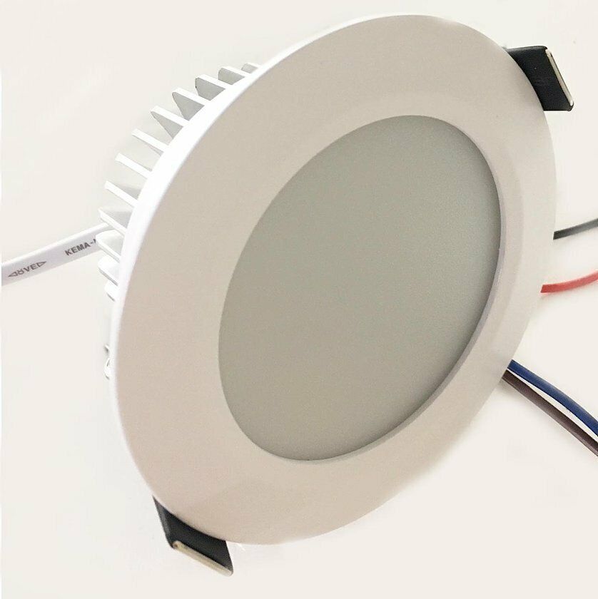 White LED recessed ceiling light with black clips and exposed wiring.