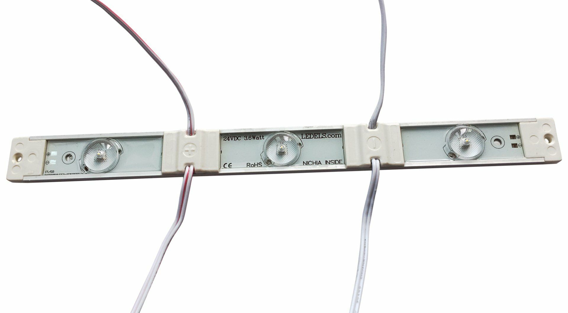 Three white LED light modules with red and white wires attached.
