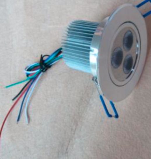 Silver LED spotlight with three lights and exposed wires.