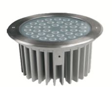 Round, silver-colored LED ground light with a ringed rim and cooling fins.