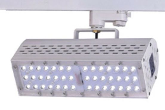 White LED track light fixture mounted on a white track system.