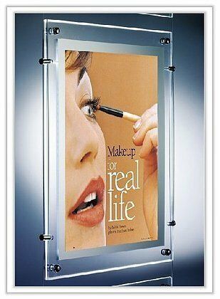 Woman applying mascara,