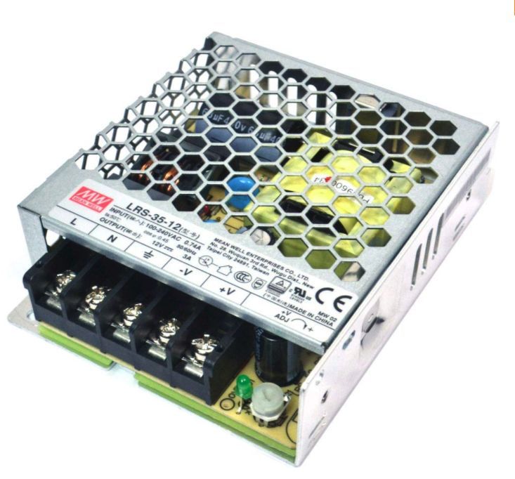 Silver metal Mean Well LRS-35-12 power supply with honeycomb top, terminal blocks, and adjustment knob.