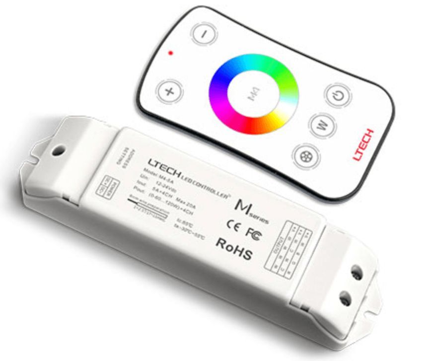 White LED controller and remote control. Controller has wiring ports. Remote has a color wheel.