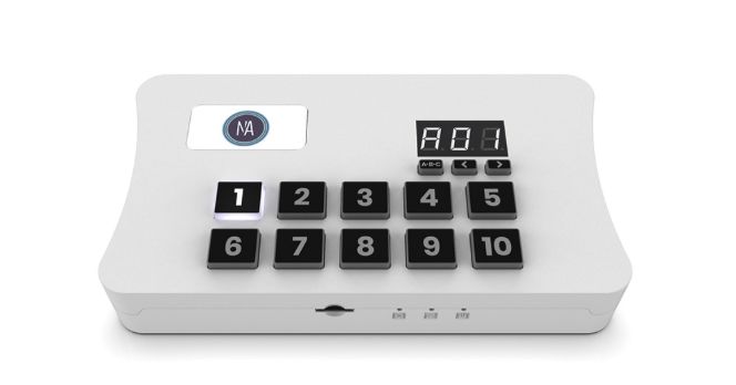 White device with numbered buttons and a digital display.