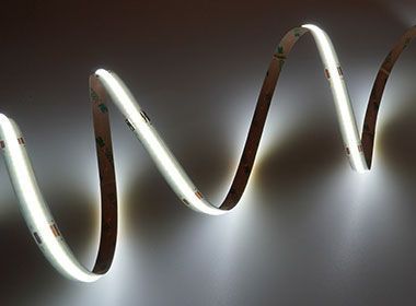 White LED light strip against a plain gray background.