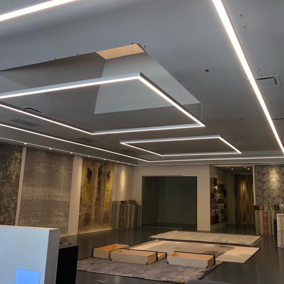 A large room with a lot of lights on the ceiling