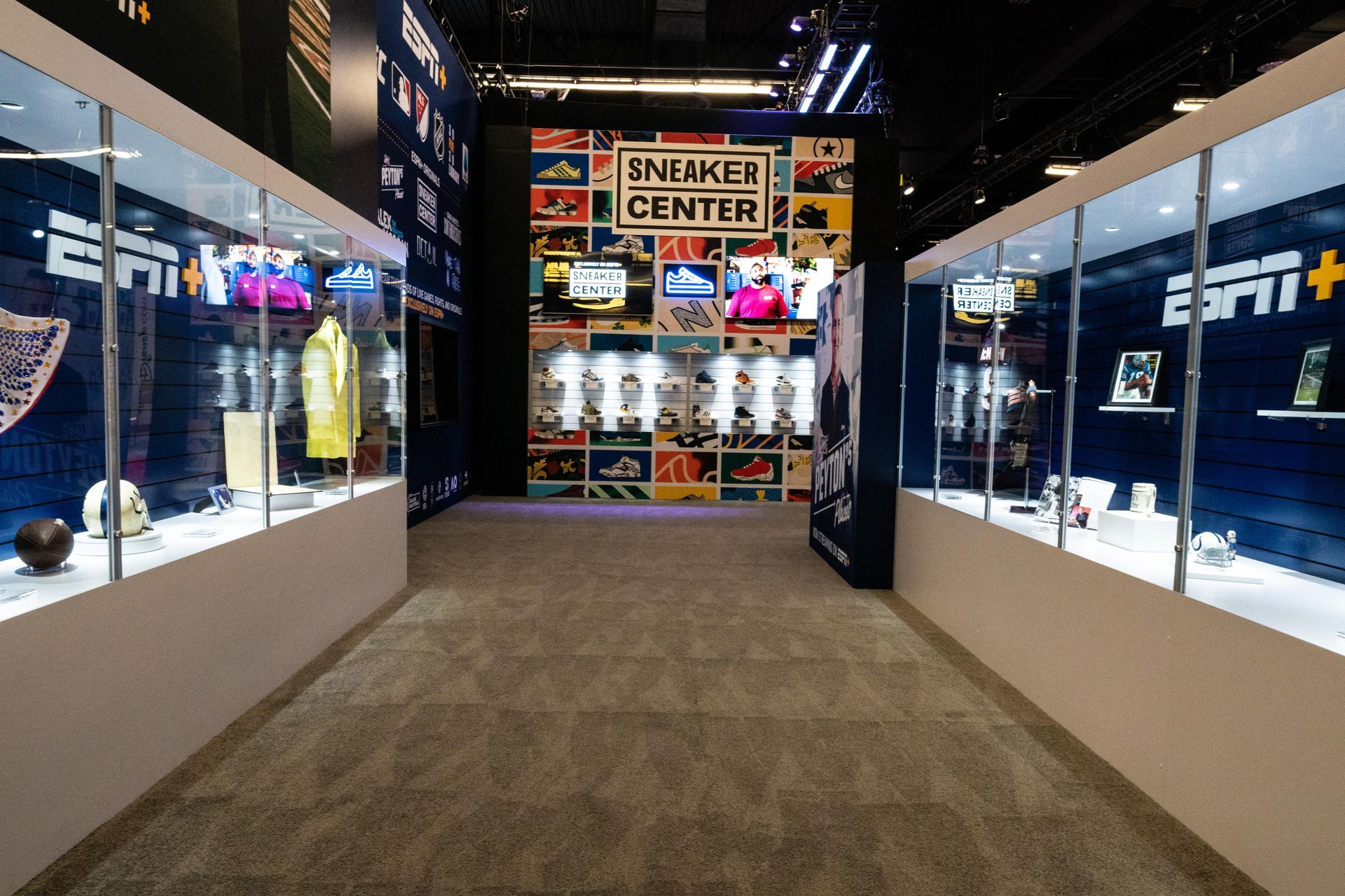 A hallway with a sign that says sneaker center on it