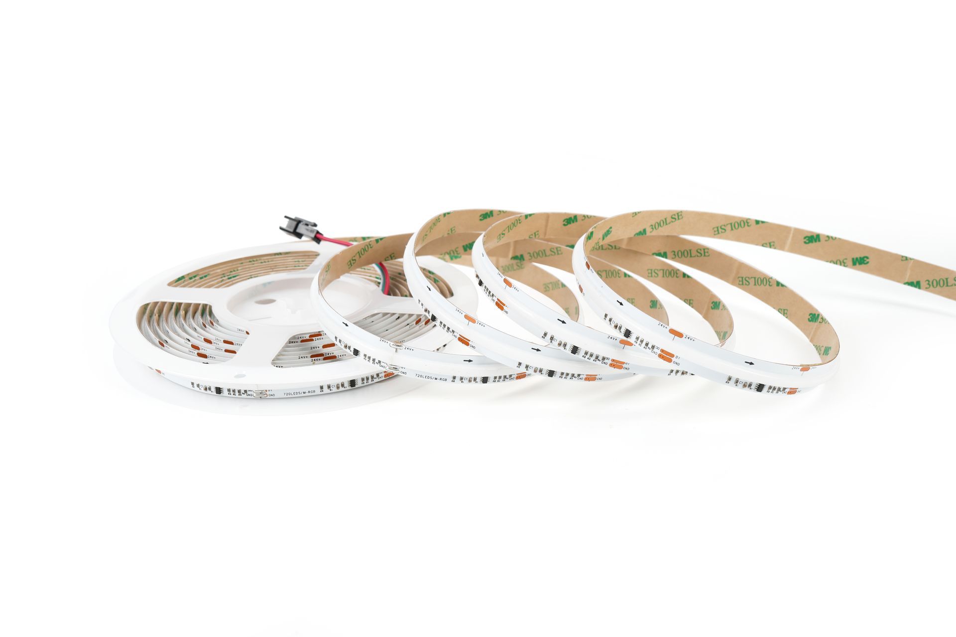LED light strip, coiled and unrolled, with adhesive backing and attached wires.