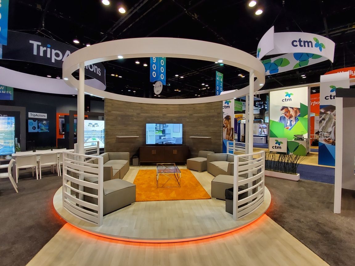 A circular room with a tv and chairs in it