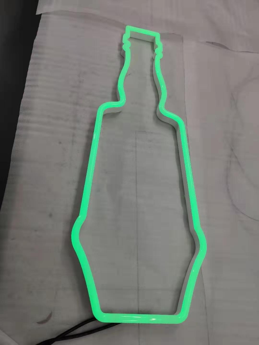A green glow in the dark bottle shaped object