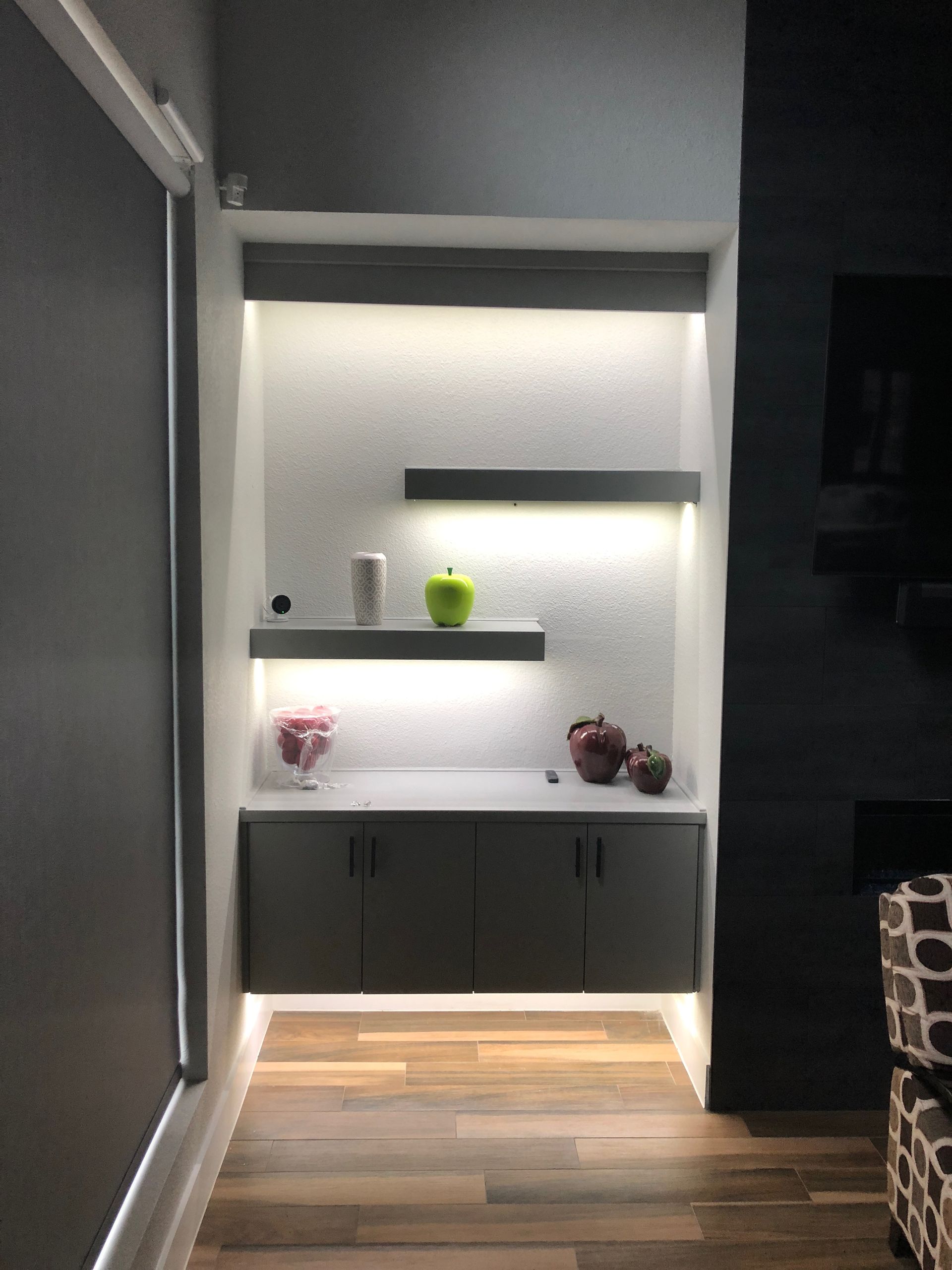 A dark room with white lights on the walls