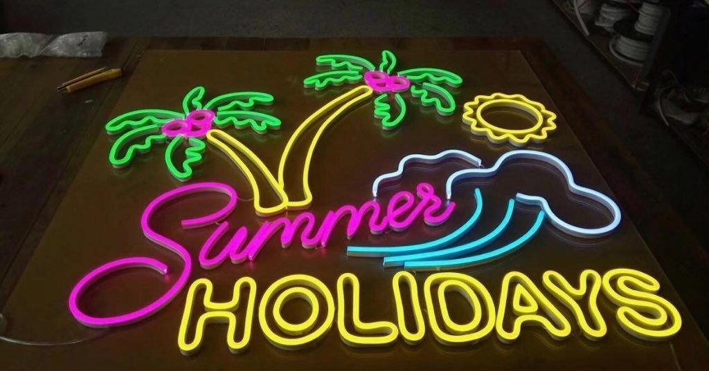 A Neon Sign that says Summer Holiday