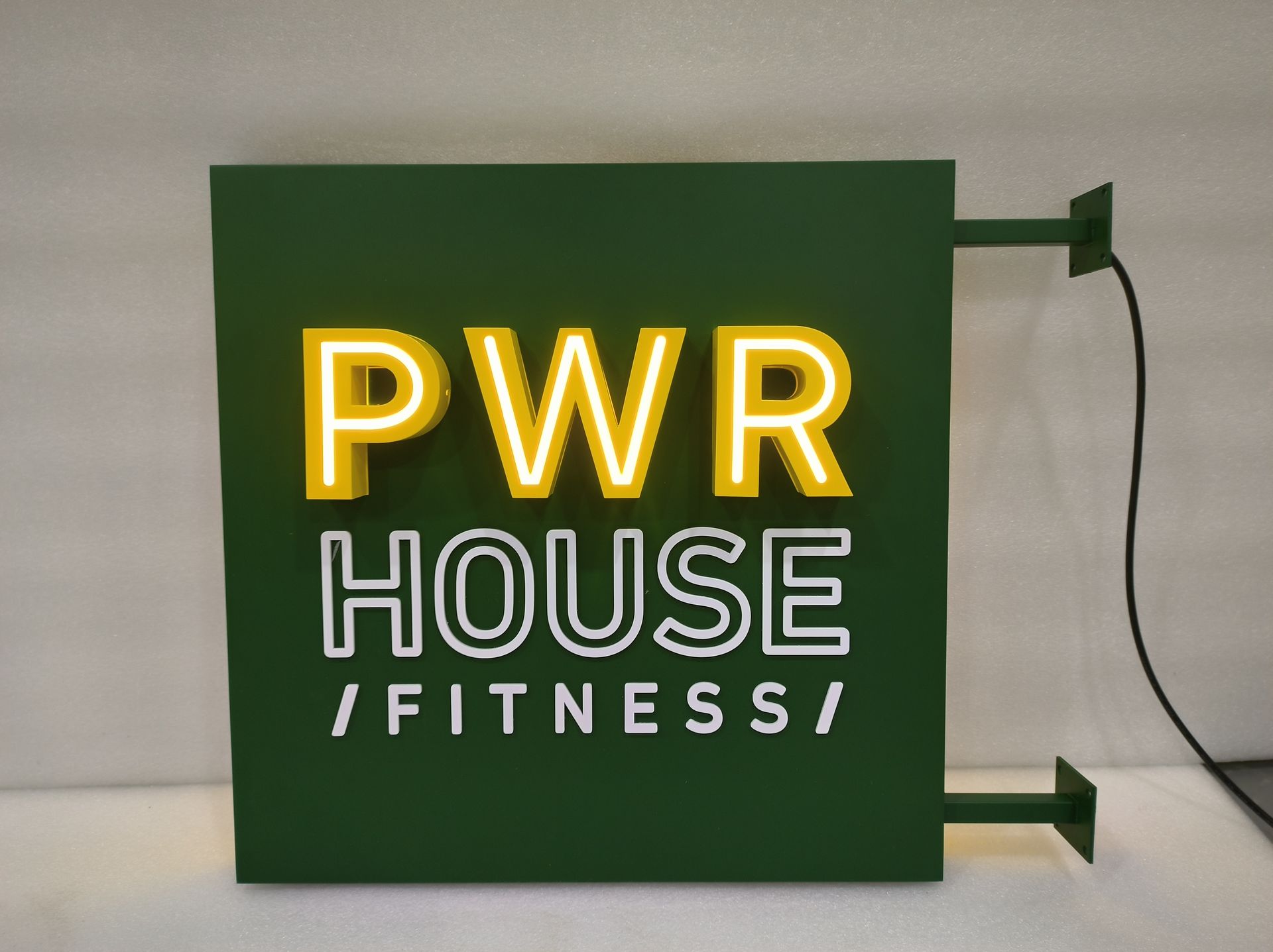 LED Sign that says PWR House Fitness
