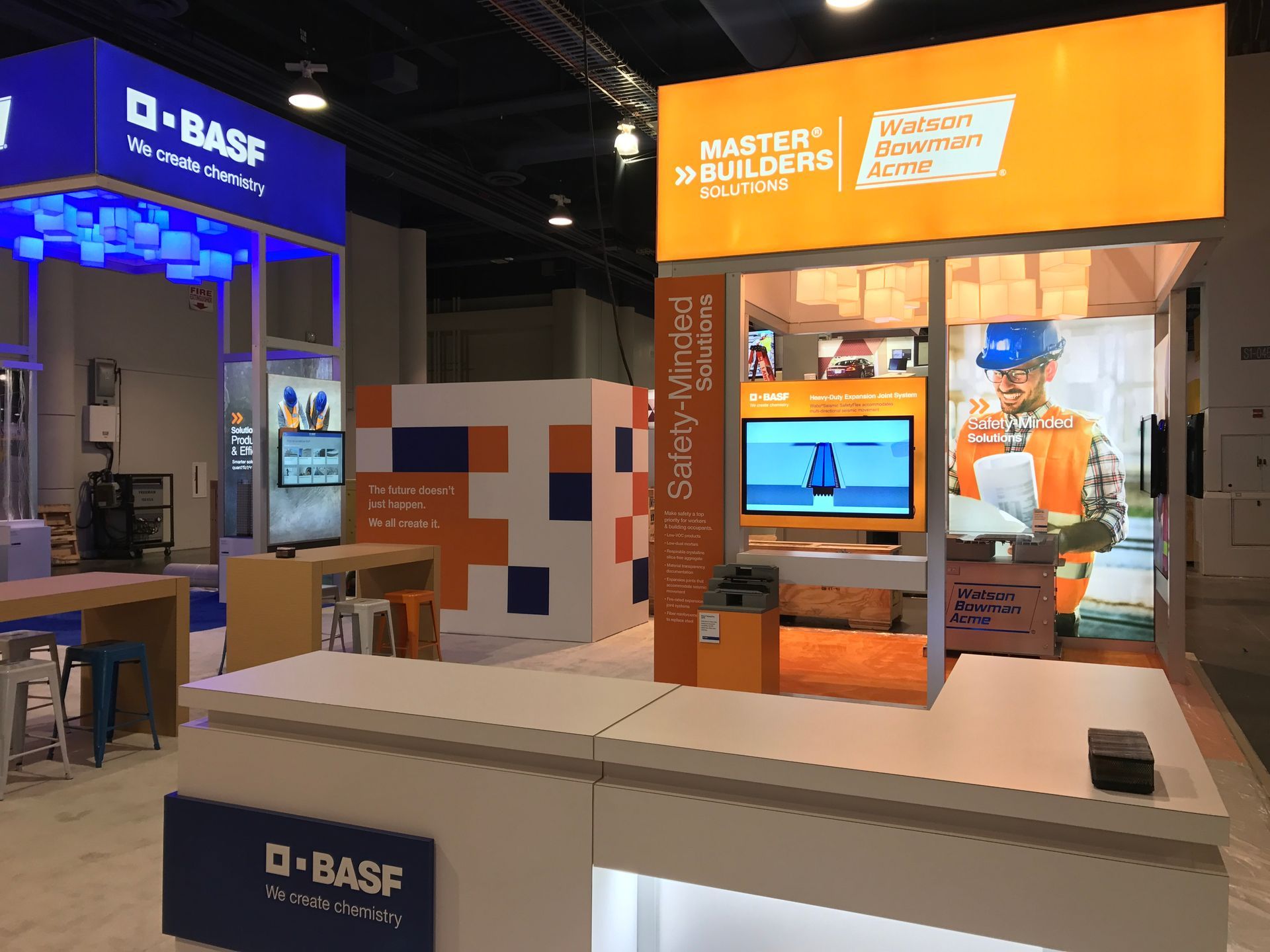 A booth at a convention with a sign that says master builders on it.