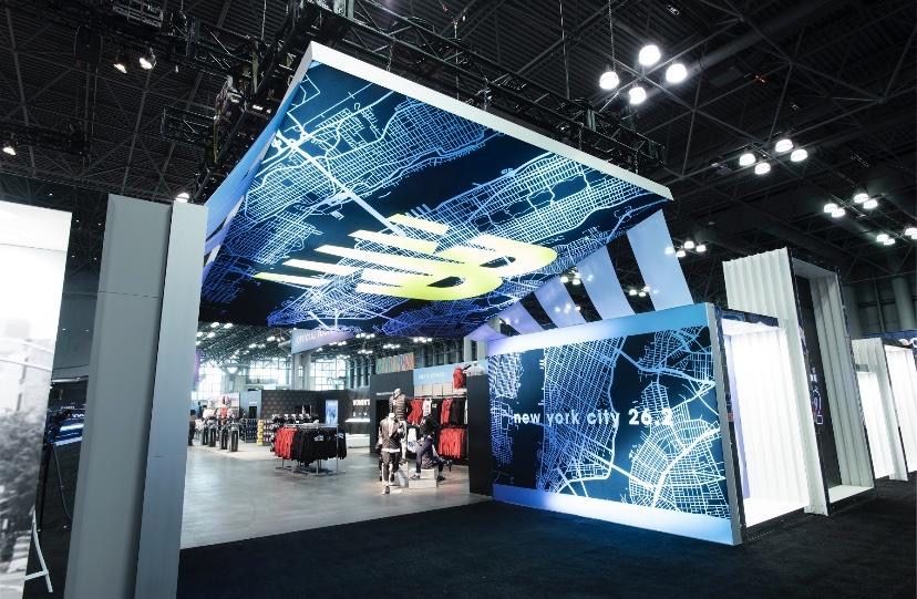 New Balance Display with Lit Up Sign on Ceiling
