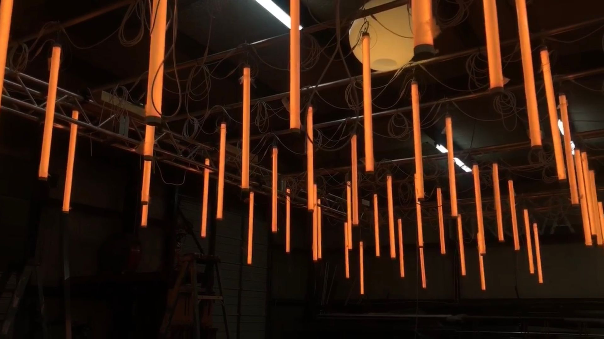 Orange Tube Lights Hanging From Ceiling