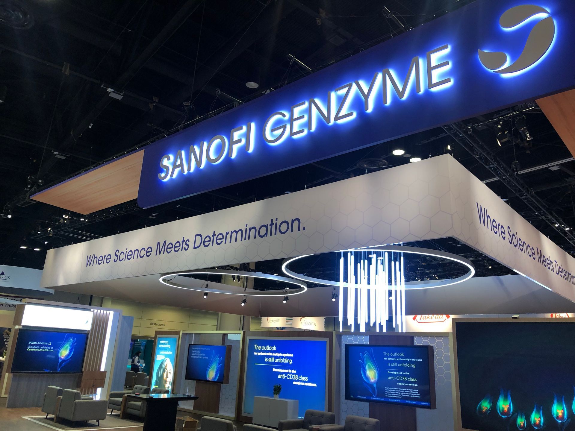 A sanofi genzyme booth at a convention